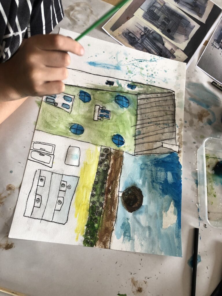 Image showing a watercolour drawing of buildings from one of Art Spark's children's art classes